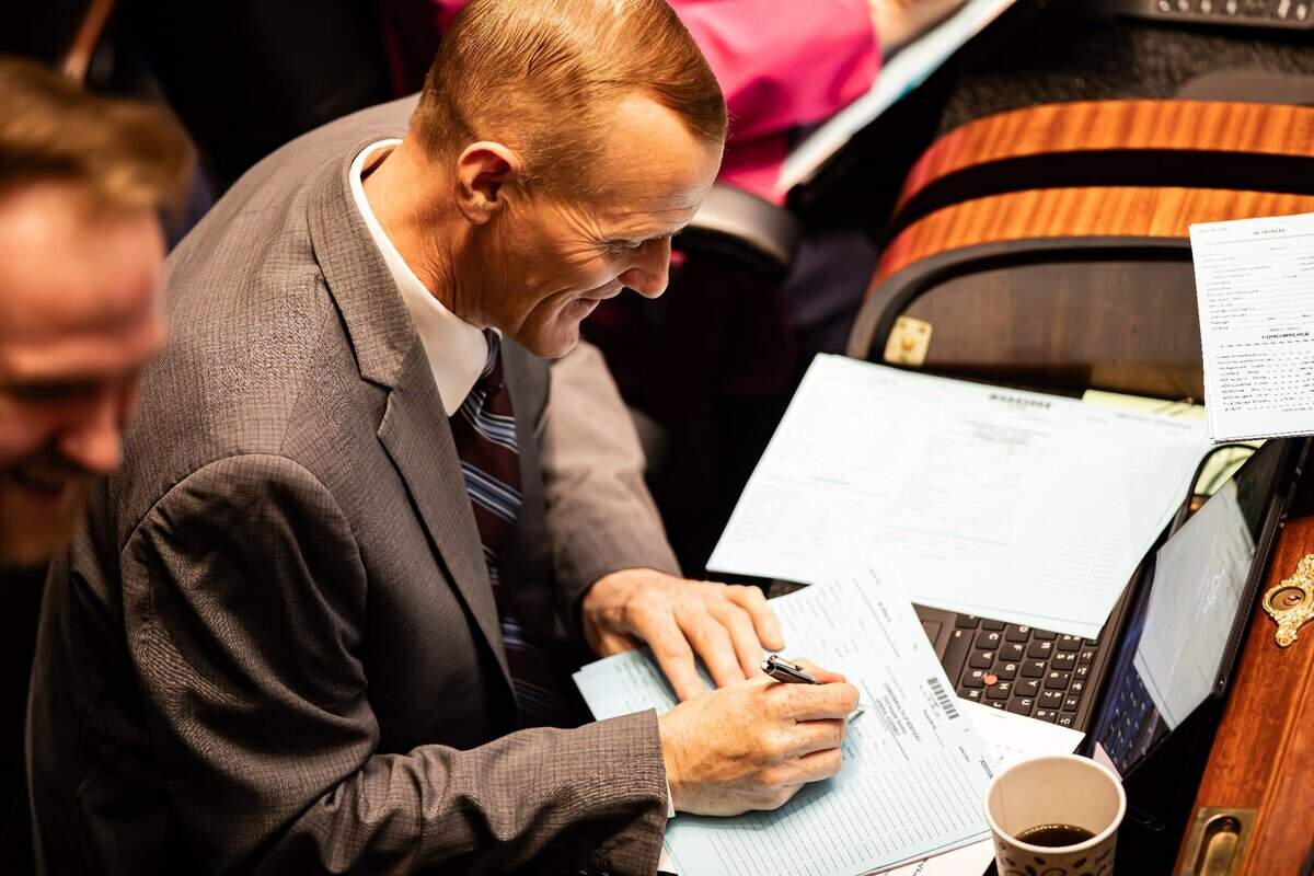 Rep. Josh Calloway (R- Irvington) completes a Commonwealth of Kentucky 2025 Regular Sessions General Assembly form on the House floor during regular sessions on Wednesday, February 12, 2025, at the Kentucky State capitol in Frankfort, Ky.  