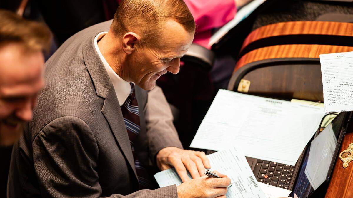 Rep. Josh Calloway (R- Irvington) completes a Commonwealth of Kentucky 2025 Regular Sessions General Assembly form on the House floor during regular sessions on Wednesday, February 12, 2025, at the Kentucky State capitol in Frankfort, Ky.  
