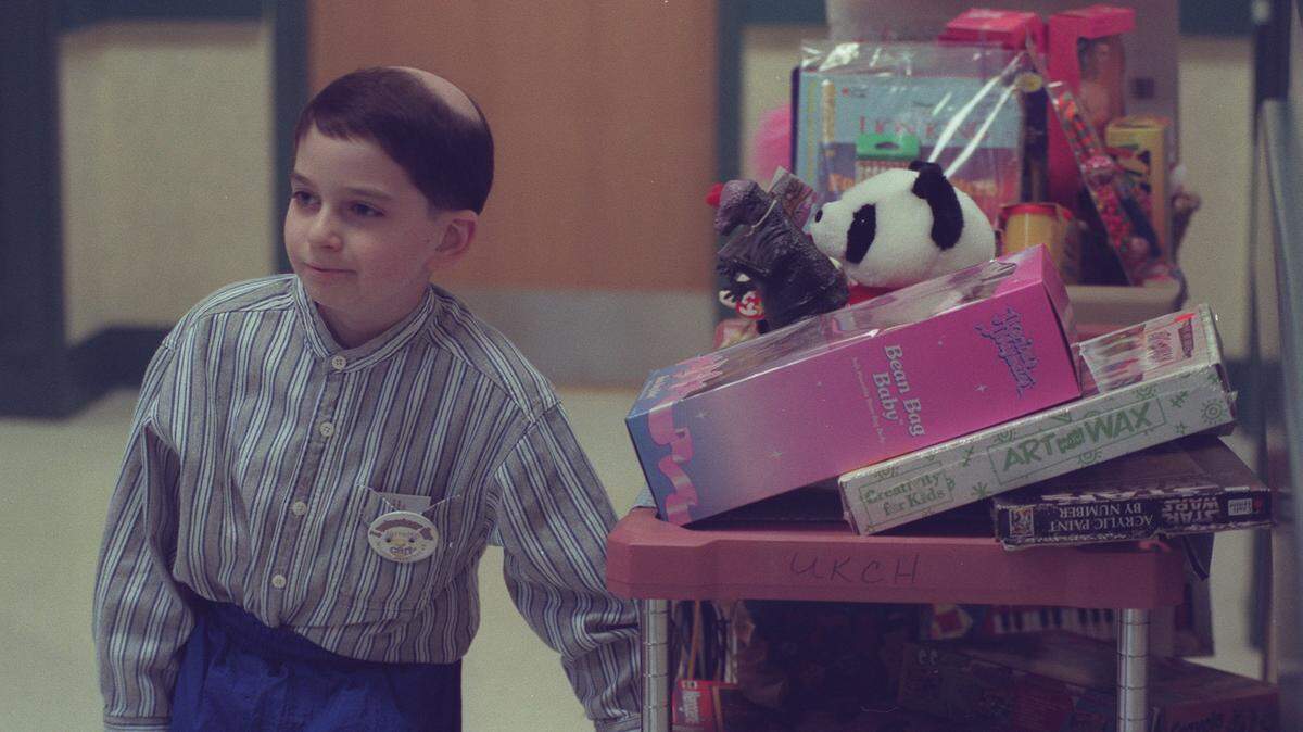 Jarrett Mynear, then 9, of Nicholasville, delivered toys to pediatric patients at UK Children’s Hospital on March 23, 1999. Jarrett had just unveiled “Jarrett’s Joy Cart” that day.