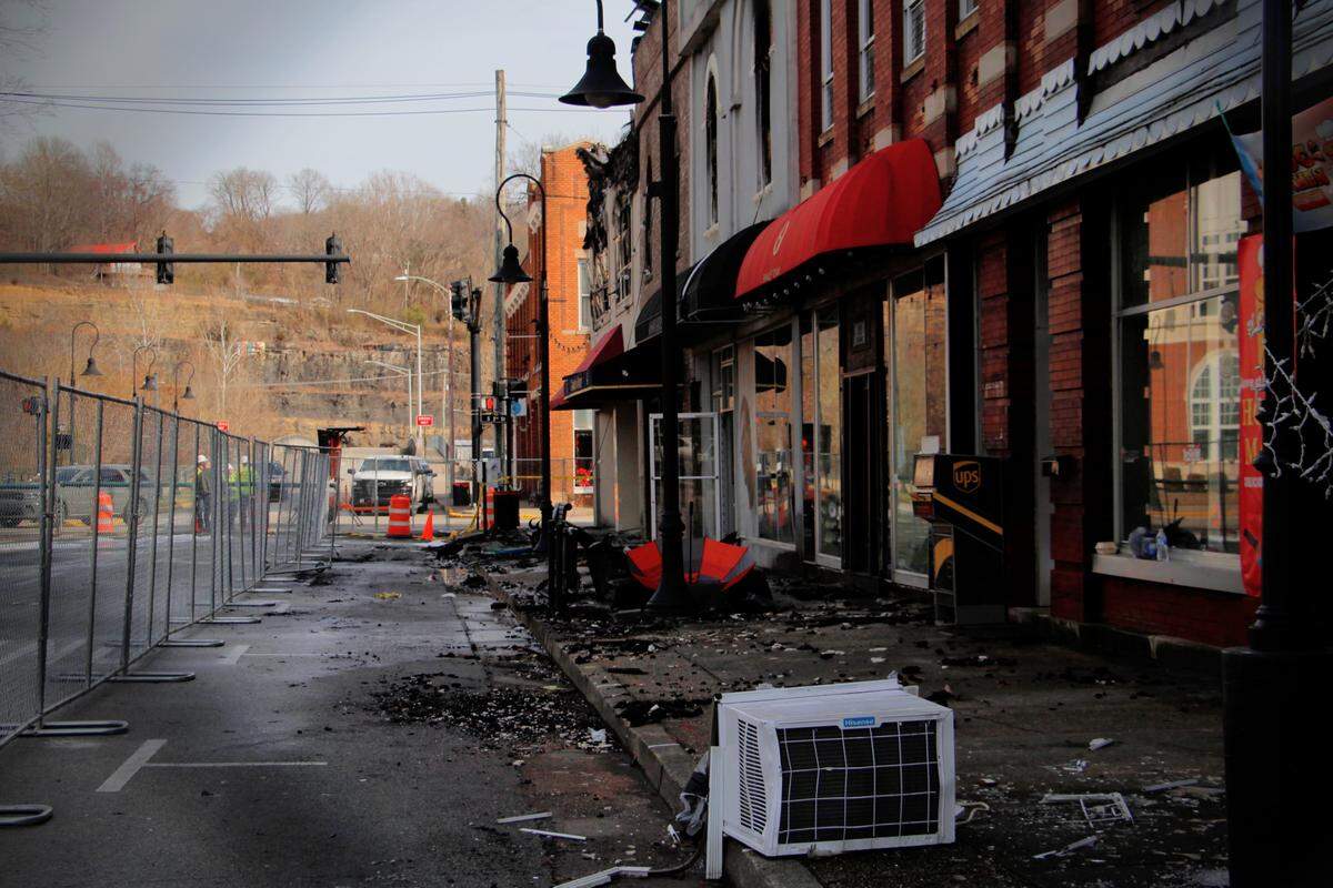 Main Street in downtown Williamsburg, Kentucky, remains cordoned off after a fire tore through several businesses fronting the historic courthouse on Tuesday, Jan. 20, 2026.