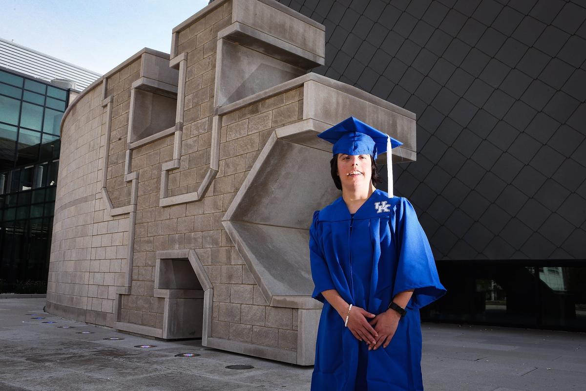 Megan McCormick, who has Down syndrome and will graduate Friday with a bachelor’s degree in liberal studies from the University of Kentucky, posed for a portrait Tuesday at the UK Student Center. Photo by Matt Goins