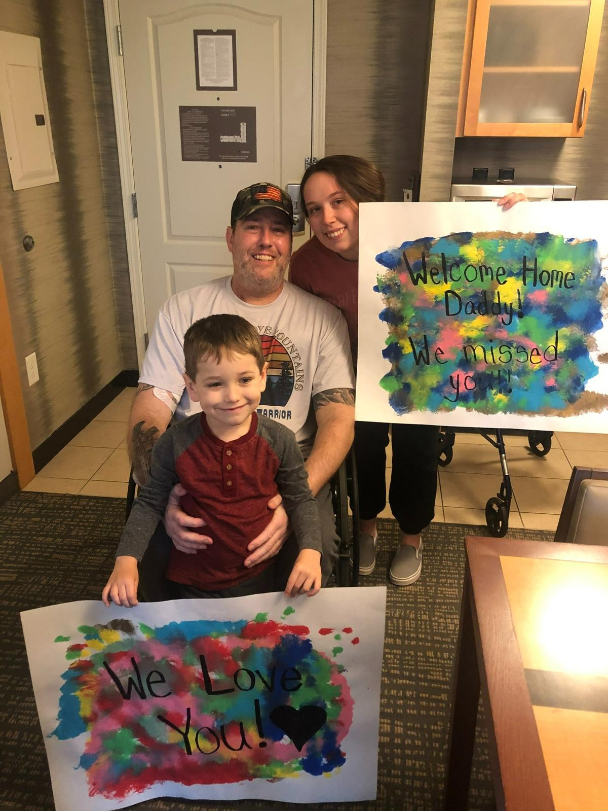 Dave Hoover, 43, is welcomed home by his son and daughter after recovering from a double lung transplant after COVID-19 damaged his lungs.