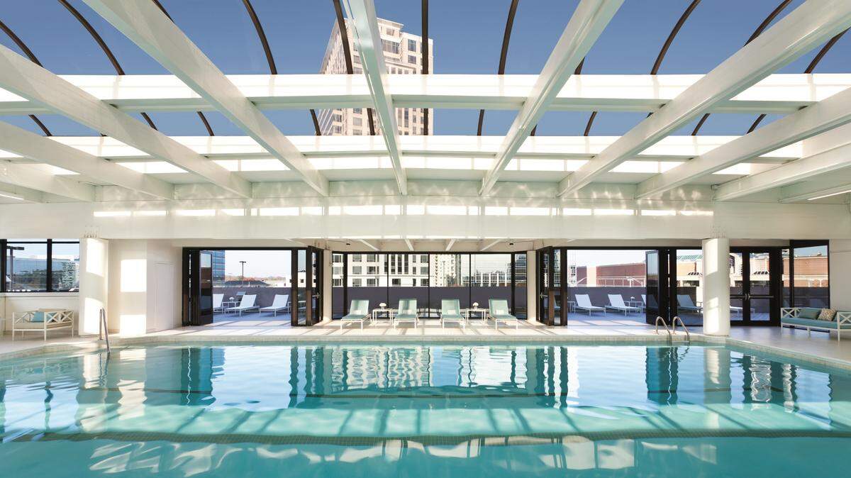 The rooftop pool at the Whitley Hotel offers stunning views of the Buckhead area.