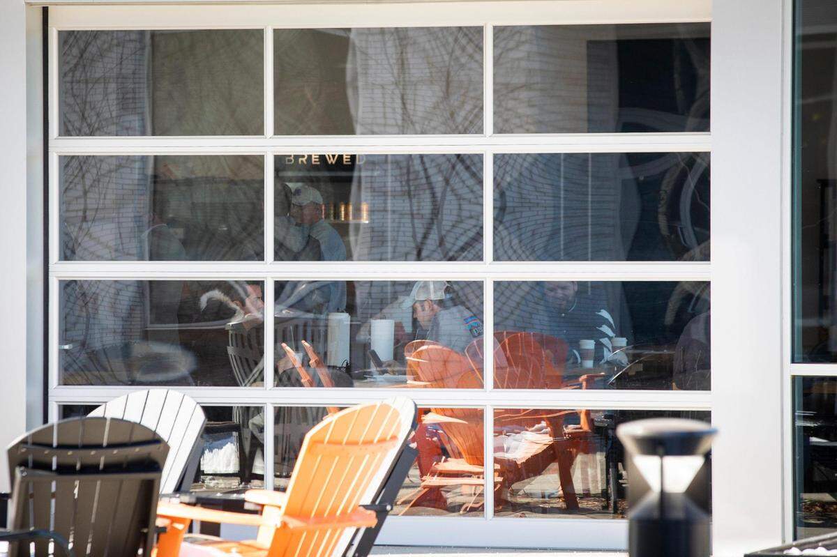 Patrons sat inside Brewed breaking Wednesday before the owner announced he was going to comply with a court order to stop food and beverage services after he refused earlier attempts to get him to stop serving indoors.