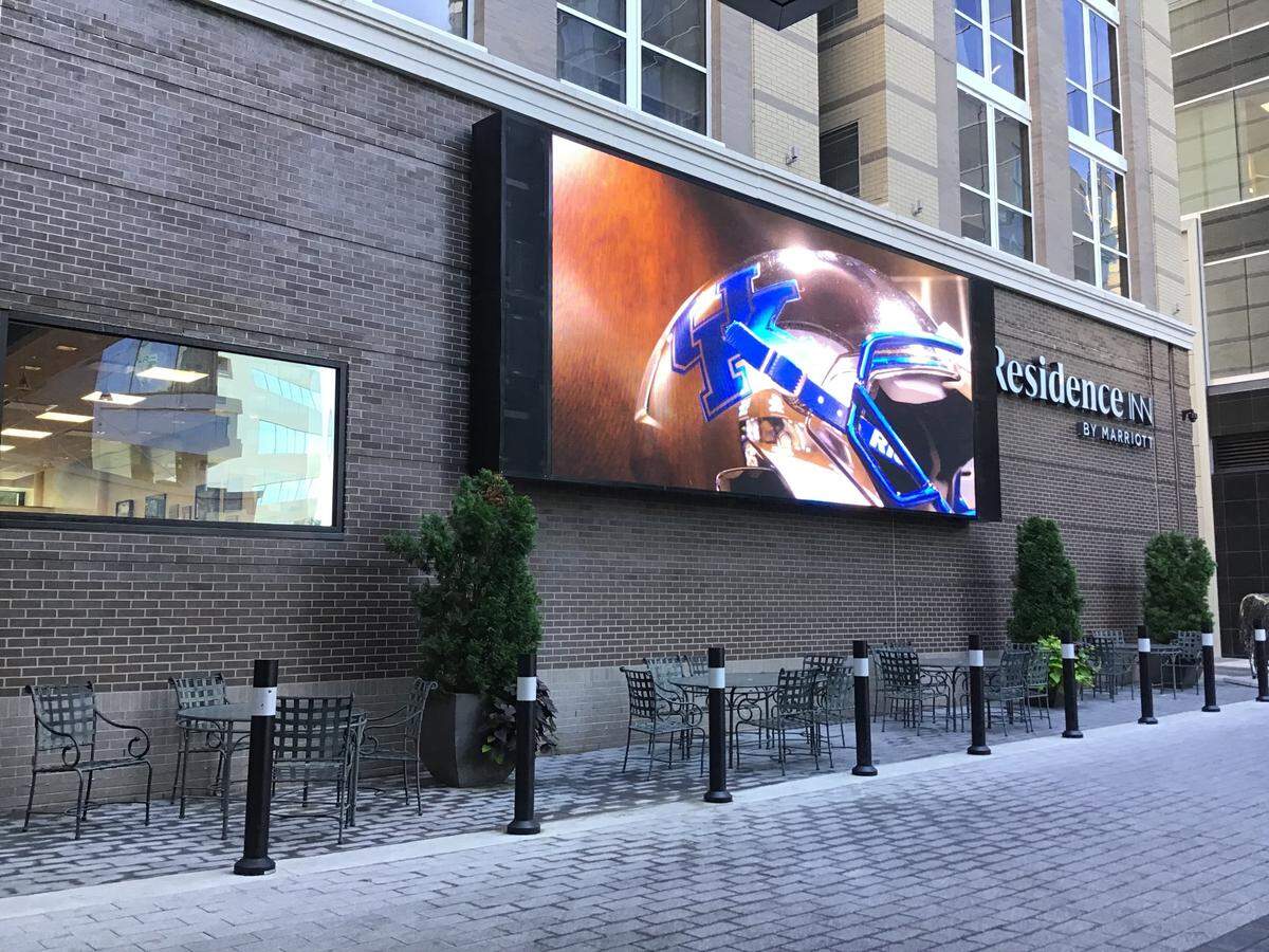 The new Sawyer’s Downtown Bar & Grill in the City Center will have seating inside the hotel courtyard area, which has a massive TV screen for watching University of Kentucky games.