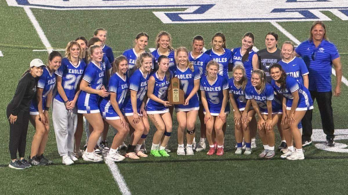 Lexington Christian’s girls lacrosse team posed with their District 8 championship trophy after defeating Lexington Catholic 10-3 at Lexington Christian Academy on Monday.