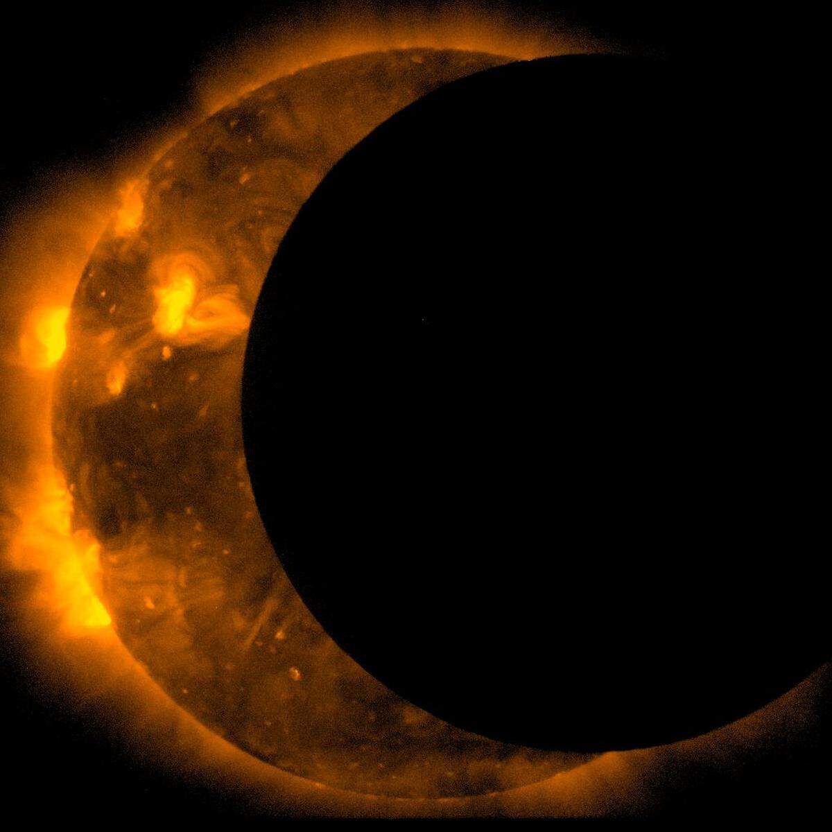 The joint JAXA/NASA Hinode mission captured these images of an annular eclipse of the Sun on May 20, 2012. &nbsp;During an annular eclipse the moon does not block the entirety of the sun, but leaves a bright ring of light visible at the edges. For the May eclipse, the moon was at the furthest distance from Earth that it ever achieves – meaning that it blocked the smallest possible portion of the sun, and leaves the largest possible bright ring around the outside. &nbsp;Scientists often use an eclipse to help calibrate the instruments on the telescope by focusing in on the edge of the moon as it crosses the sun and measuring how sharp it appears in the images. Photo shared via Wikimedia Commons. 