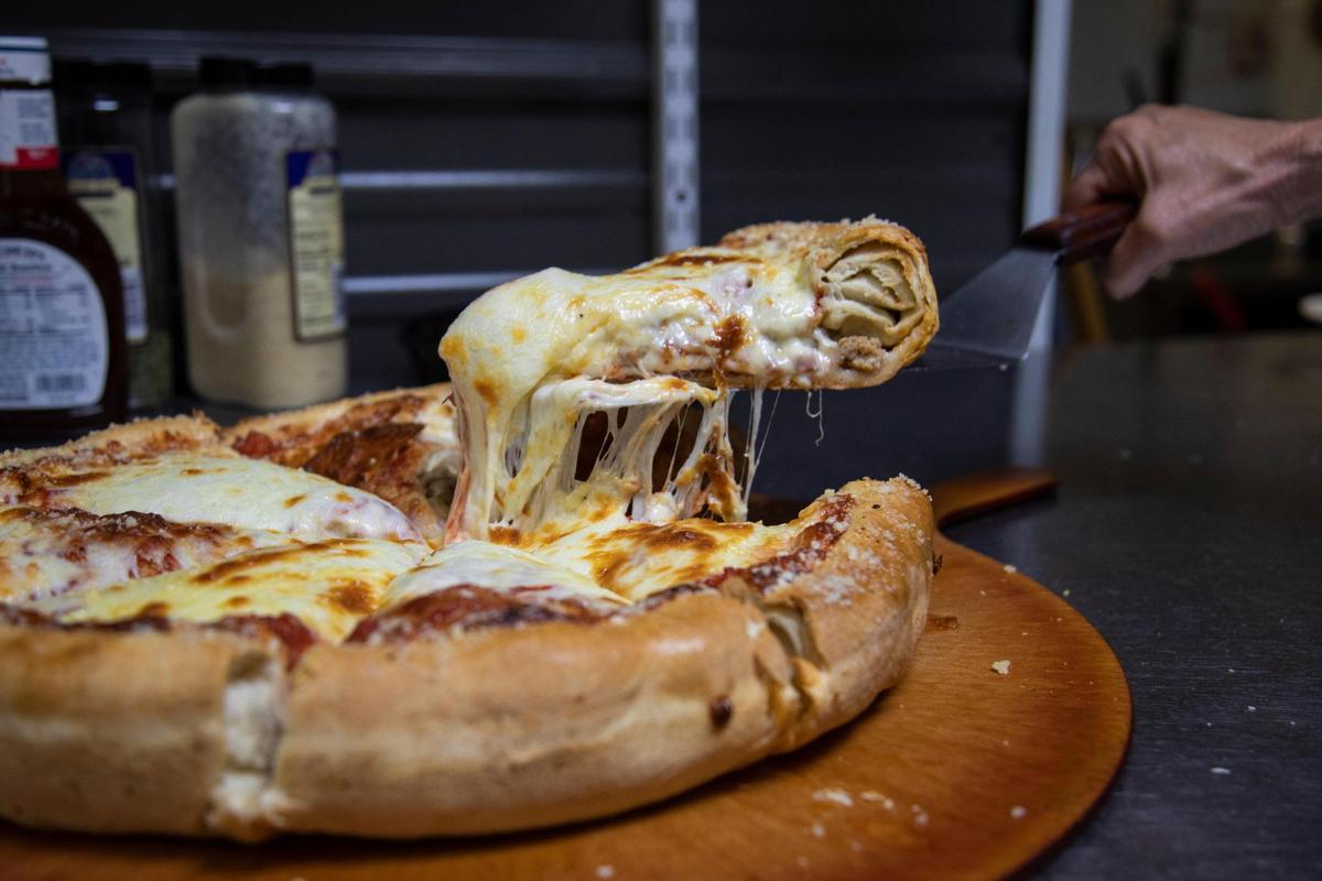 Stellian’s 8-pound pizza is made with a thick house made crust and takes 45 minutes to cook.