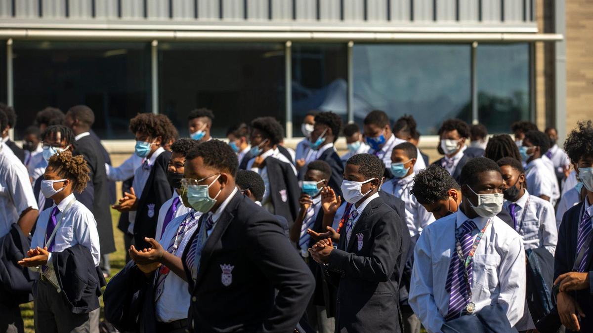 Students at Carter G. Woodson Academy listen during a media conference announcing AppHarvest’s first container farm in an urban location, located outside the school in Lexington, Ky., on Friday, Sept. 17, 2021.