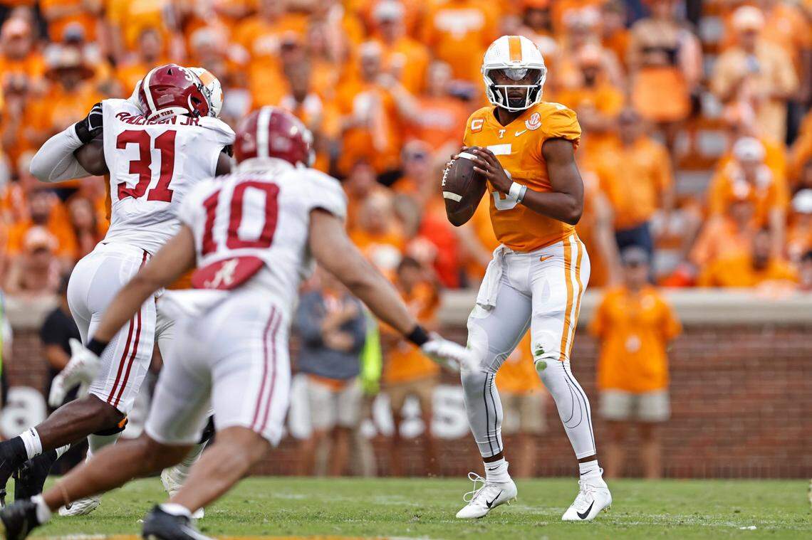 Tennessee quarterback Hendon Hooker (5) looks for a receiver during the first half of an NCAA college football game against Alabama Saturday, Oct. 15, 2022, in Knoxville, Tenn. (AP Photo/Wade Payne)