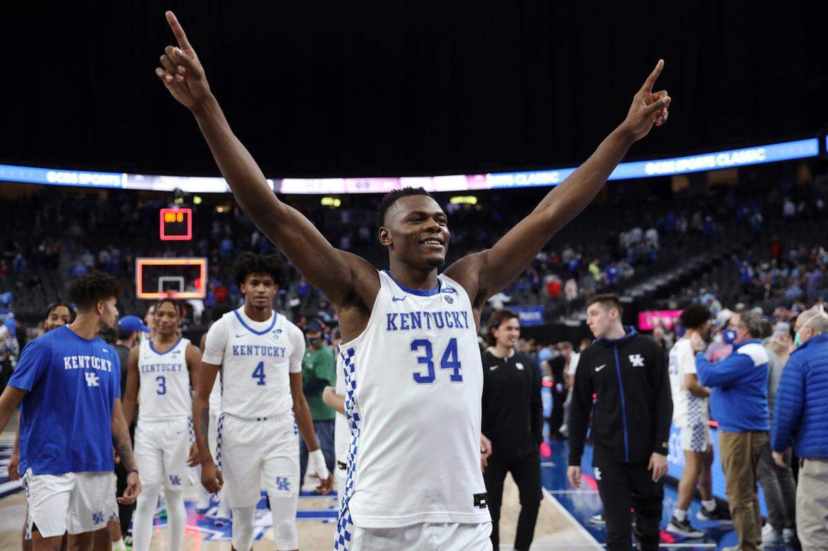 Kentucky’s Oscar Tshiebwe (34) celebrates after defeating North Carolina following an NCAA college basketball game, Saturday, Dec. 18, 2021, in Las Vegas.
