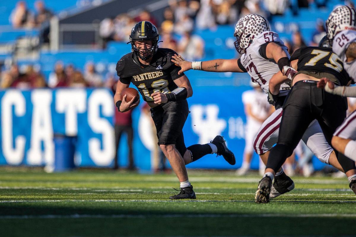 Russellville quarterback Lennon Ries (12) looked for running room during Friday’s game at Kroger Field. Ries rushed for 10 yards and passed for 97 on the day.