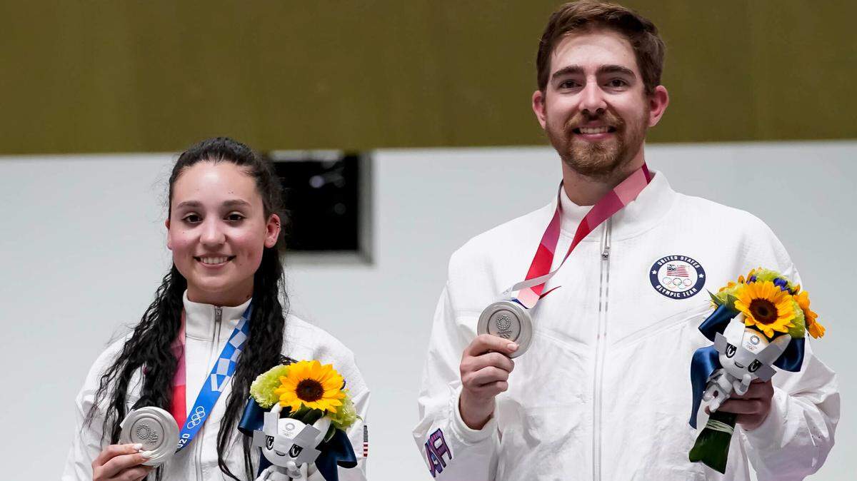 Silver medalists Mary Tucker, left, and Lucas Kozeniesky of the United States celebrated after the mixed team 10-meter air rifle competition at the Asaka Shooting Range at the Summer Olympics on Tuesday in Tokyo.