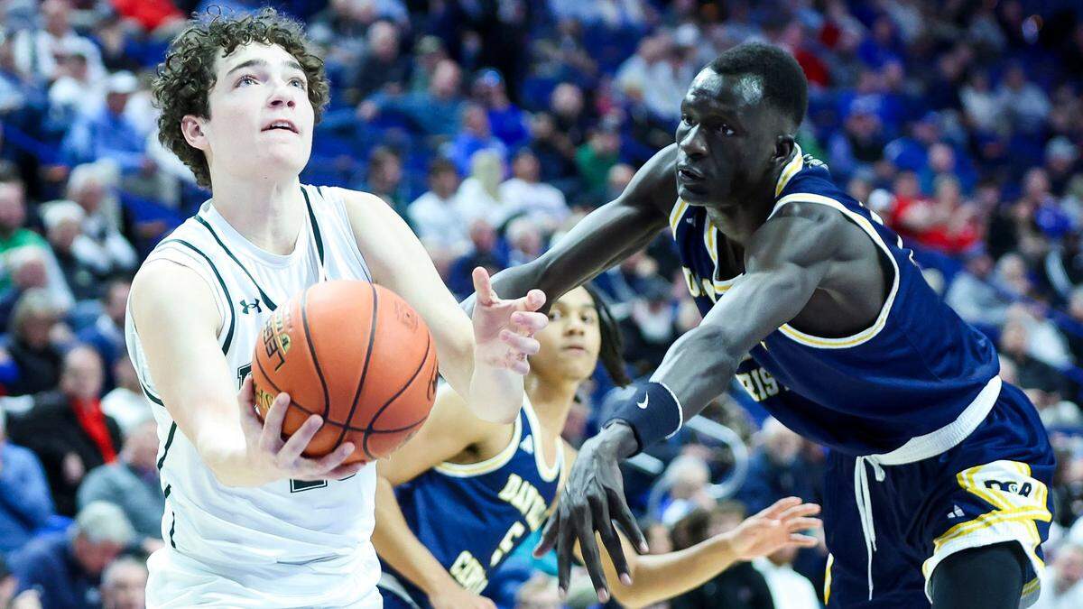 South Oldham’s Drew Campbell drives past Danville Christian’s Leek Ateny on Wednesday night. Campbell made both of his 3-point attempts and finished with eight points.
