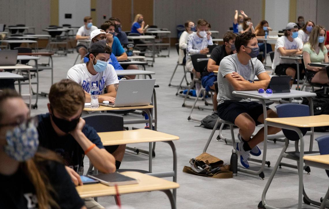 Students attend the first day of class for a journalism 101 class taught by Jen Smith in the Frank Harris Ballroom inside the Gatton Student Center that was converted to a classroom that would allow better social distancing in Lexington, Ky., Monday, August 17, 2020. The class is being conducted in a hybrid format that will meet in person on Mondays and Wednesdays and will meet via Zoom on Fridays.