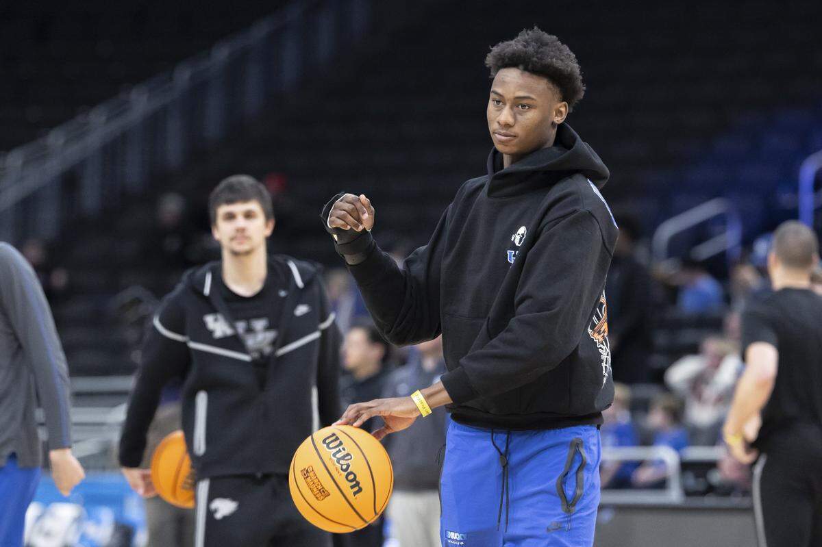Kentucky guard Jaxson Robinson passes a ball to his teammates during an open practice at Fiserv Forum in Milwaukee on Thursday, March 20, 2025, a day before Kentucky’s first round NCAA Tournament game against Troy.