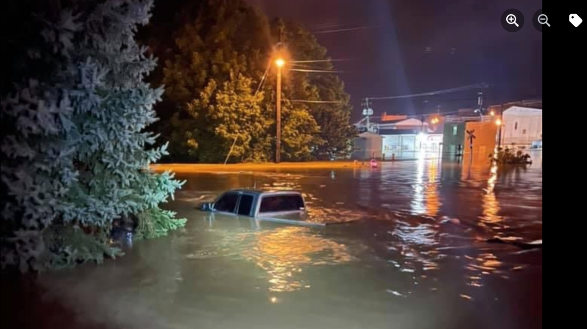 Floodwater almost covered a pickup truck in Nicholas County. Relief efforts are ongoing following Friday’s flooding.