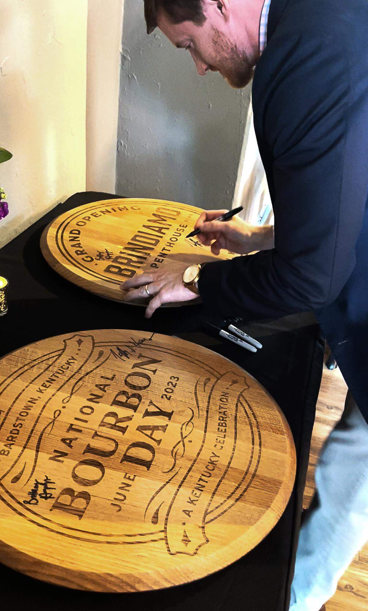 Sam Lacy signied a Brindiamo Penthouse grand opening barrel head to commemorate the day