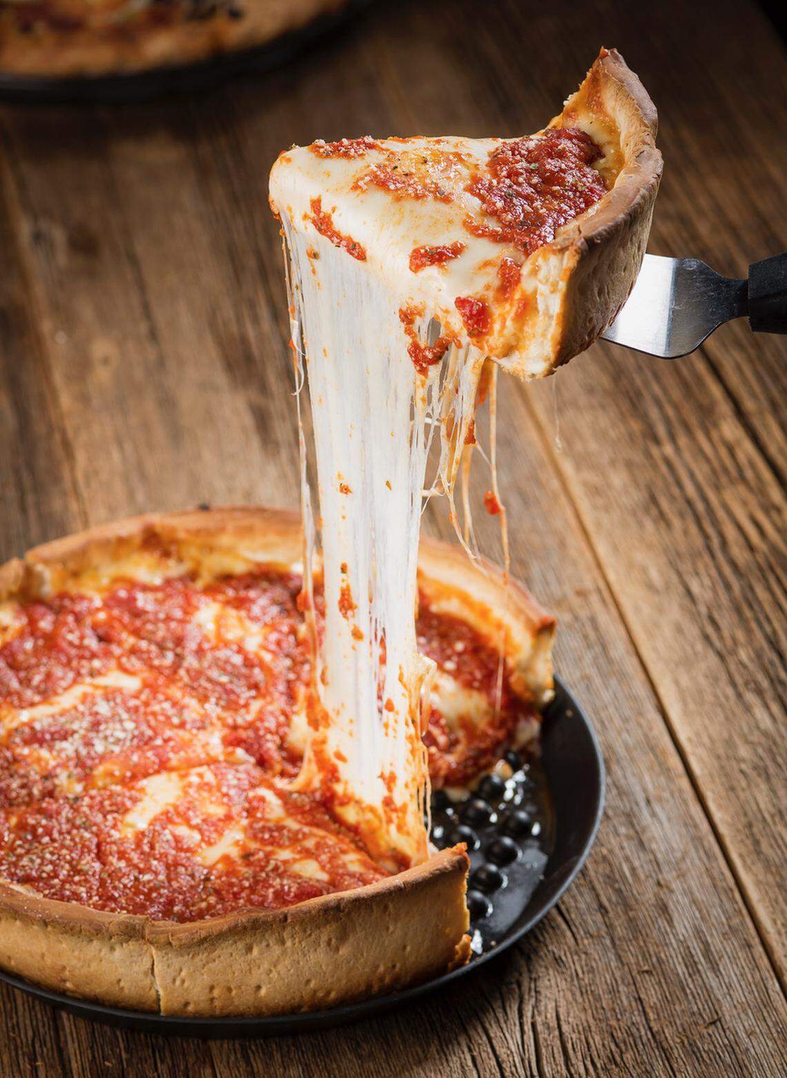 Rosati’s offers several unique pizzas, including Deep Dish Chicago-style made with loads of mozzarella and the tomato sauce on top.
