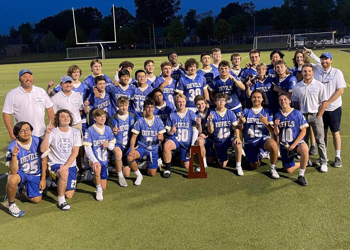 The Henry Clay boys’ lacrosse team celebrates its Commonwealth Lacrosse League state championship after defeating Lexington Catholic 12-8 at Lafayette High School in Lexington in May.