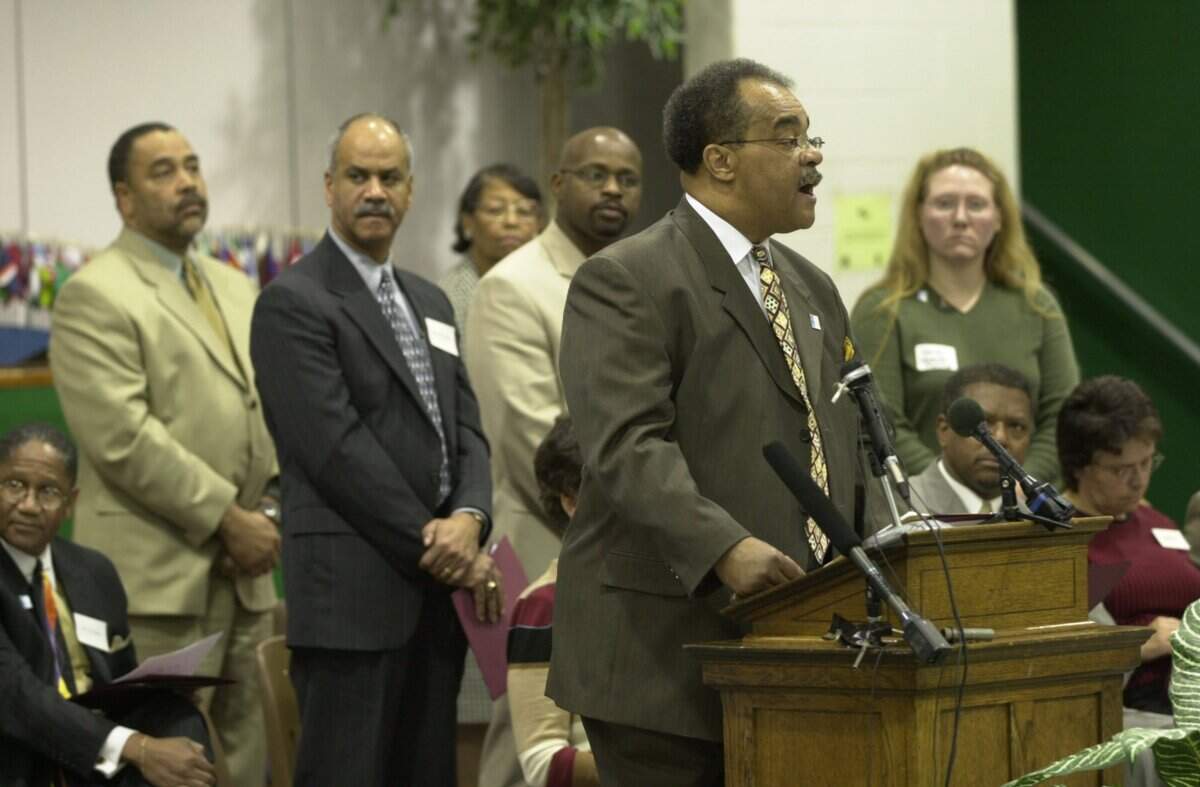 Rev. Bob Brown introduces members of the new committee as Fayette County leaders gather at Booker T. Washington Elementary School to announce the formation of a blue ribbon panel charged with finding ways to close the achievement gap in Lexington, Ky., on 3/28/02.