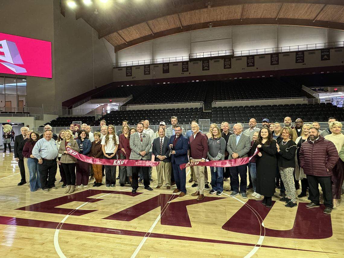 Eastern Kentucky University President David T. McFaddin cuts a ceremonial ribbon Monday to reopen Baptist Health Arena at Alumni Coliseum following a renovation project in Richmond.