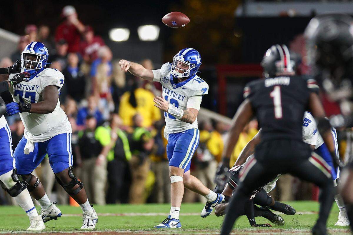 Kentucky quarterback Devin Leary (13) loses control of the ball near the end of Saturday’s game against South Carolina.