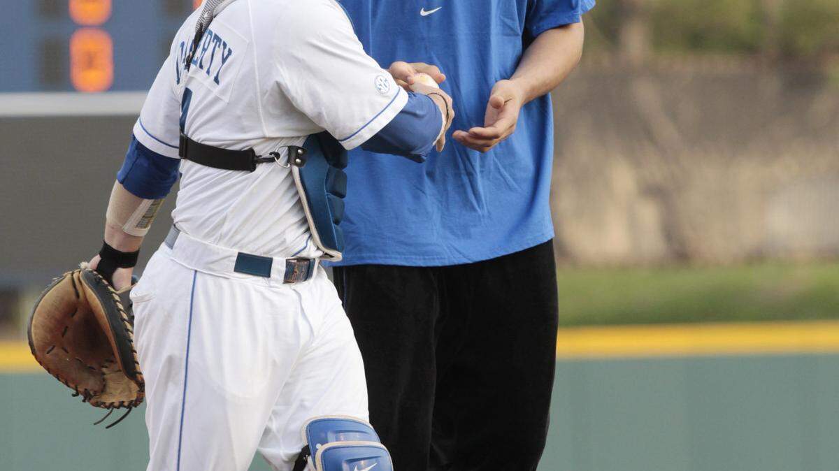 Kentucky's hard-luck center, Enes Kanter, had a few laughs with UK baseball's T.J. Daugherty after he threw out the first pitch Friday at Cliff Hagan Stadium. Kanter said he's busy finishing his classes and will soon head to Chicago to prepare for the NBA Draft. After not playing a single game in college, he's projected to be picked as high as fourth overall.        