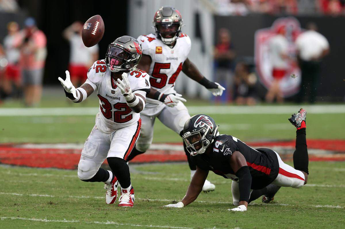 Tampa Bay safety Mike Edwards (32) intercepts a pass and returns it for a score this season against Atlanta. Edwards has been suspended for three games.
