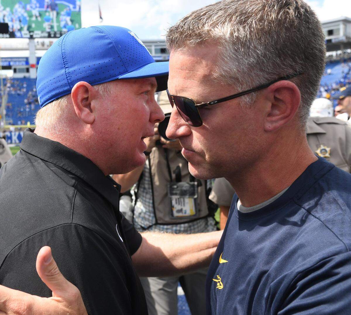 Kentucky coach Mark Stoops greeted Toledo head man Jason Candle after UK’s 38-24 win over the Rockets in the 2019 season opener at Kroger Field.