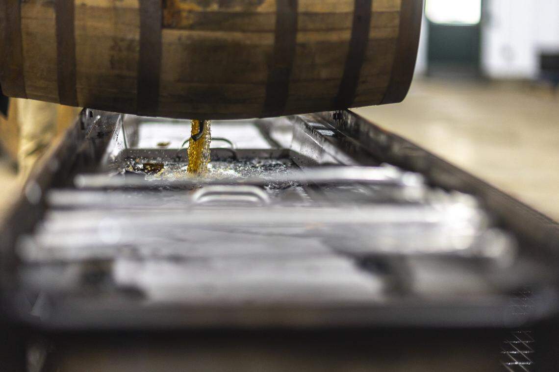 Bourbon is drained from a barrel at Green River Distillery in Owensboro, Ky., on Wednesday, Sept. 24, 2025.