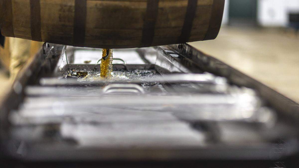 Bourbon is drained from a barrel at Green River Distillery in Owensboro, Ky., on Wednesday, Sept. 24, 2025.