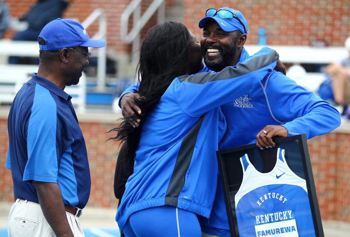 Edrick Floreal, right, received a hug during Senior Day activities at UK in 2016. Floreal was hired by Texas on Wednesday after six seasons as UK head coach.