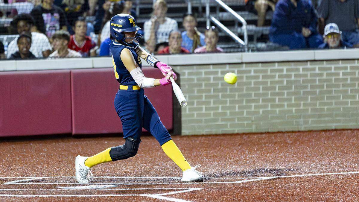 Bryan Station’s Adrienn Arcure hits a double to left field during the 11th Region Softball Tournament semifinals at George Rogers Clark High School on Thursday in Winchester.