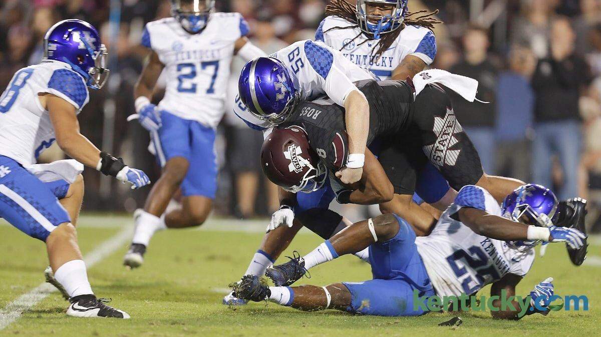 Kentucky Wildcats long snapper Kelly Mason (59) tackled Mississippi State wide receiver Fred Ross (8) in the second quarter of the Kentucky at Mississippi State football game at Davis Wade Stadium in Starkville, Miss., on Oct. 24, 2015. Photo by Pablo Alcala | Staff