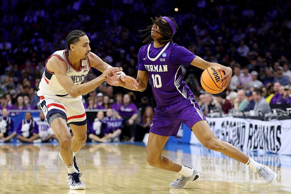 New Kentucky guard Alex Wilkins (10) had 21 points and four assists for Furman in the Paladins’ 82-71 loss to Connecticut in last season’s NCAA Tournament round of 64.