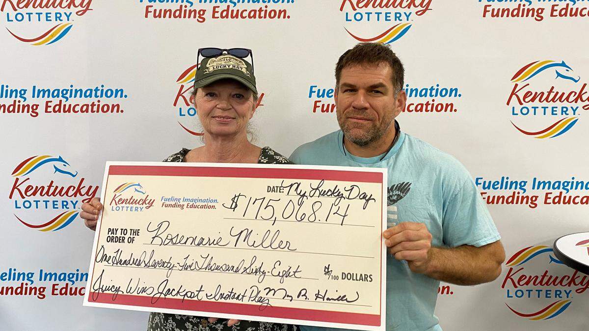 Rosemarie Miller, poses with her husband Michael, after winning more than $175,000 playing the Kentucky Lottery.