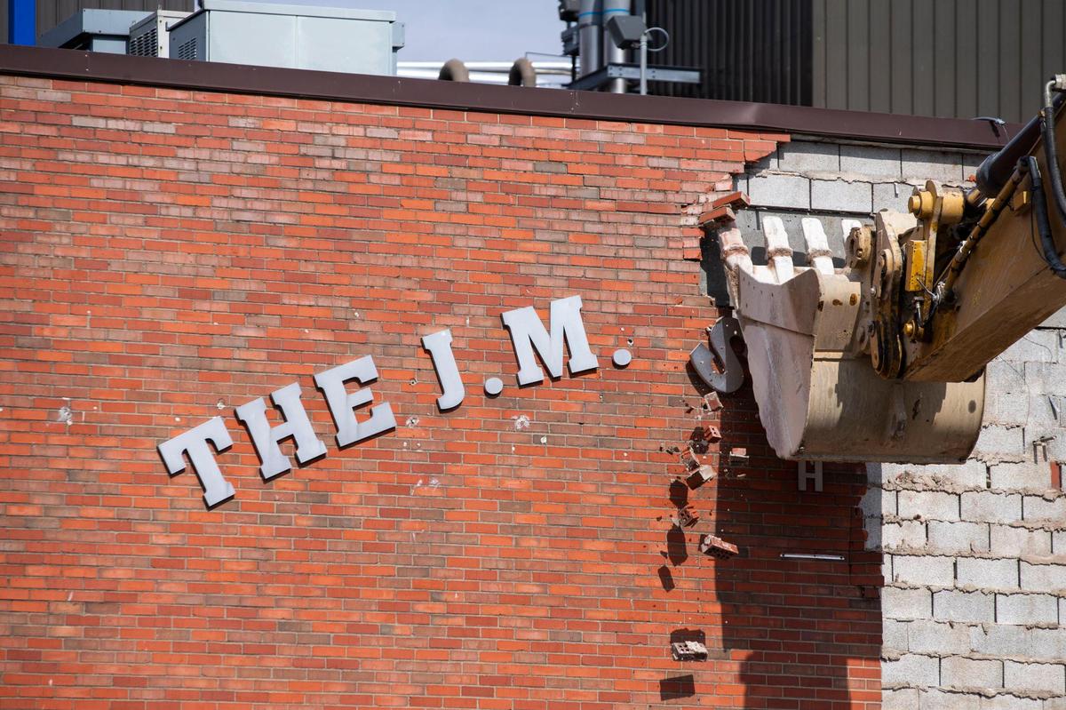 An excavator removes the rest of a brick wall after part of it fell at the J. M. Smuckers factory on Winchester Road falls in Lexington Ky., Wednesday, February 24, 2021.