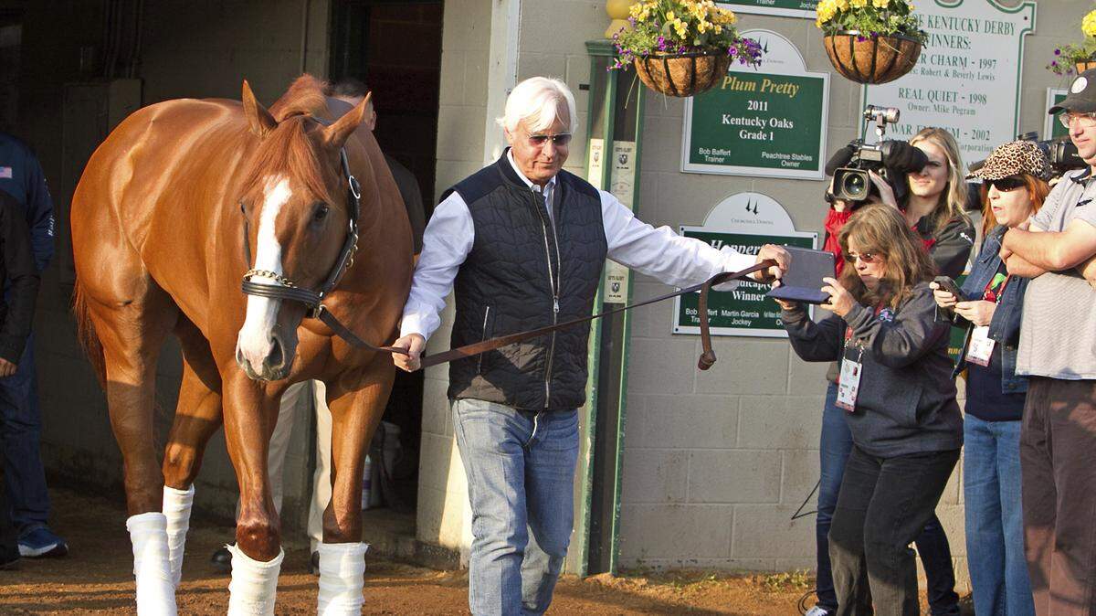 Trainer Bob Baffert, right, led Justify out of Barn 33 at Churchill Downs the morning after their Kentucky Derby victory.