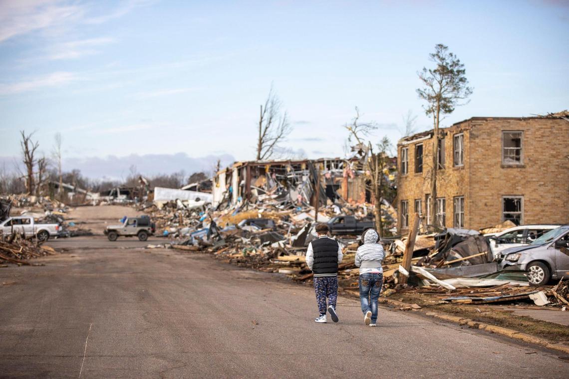 Buildings are demolished in downtown Mayfield, Ky., on Saturday, after a tornado traveled through the region Friday night.