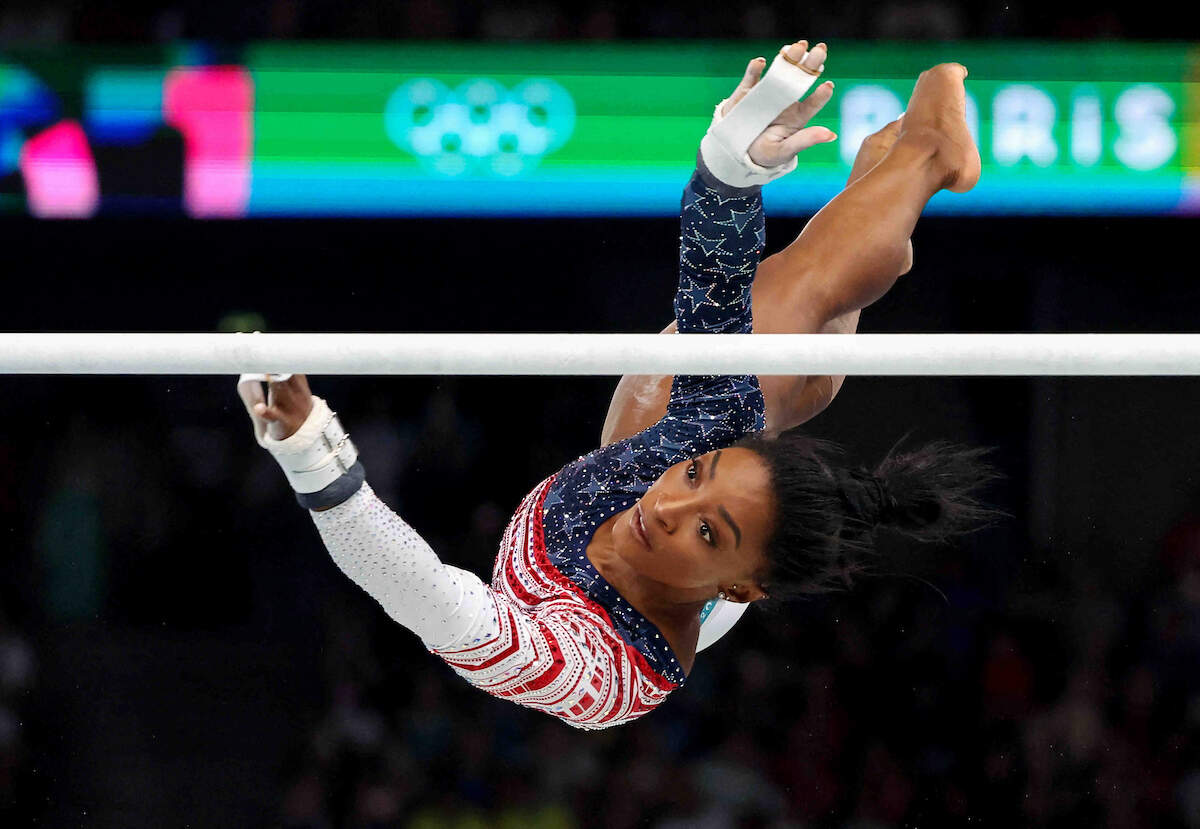 Paris 2024 Olympics - Artistic Gymnastics - Women’s Team Final - Bercy Arena, Paris, France - July 30, 2024. Simone Biles of United States in action on the Uneven Bars. REUTERS/Mike Blake