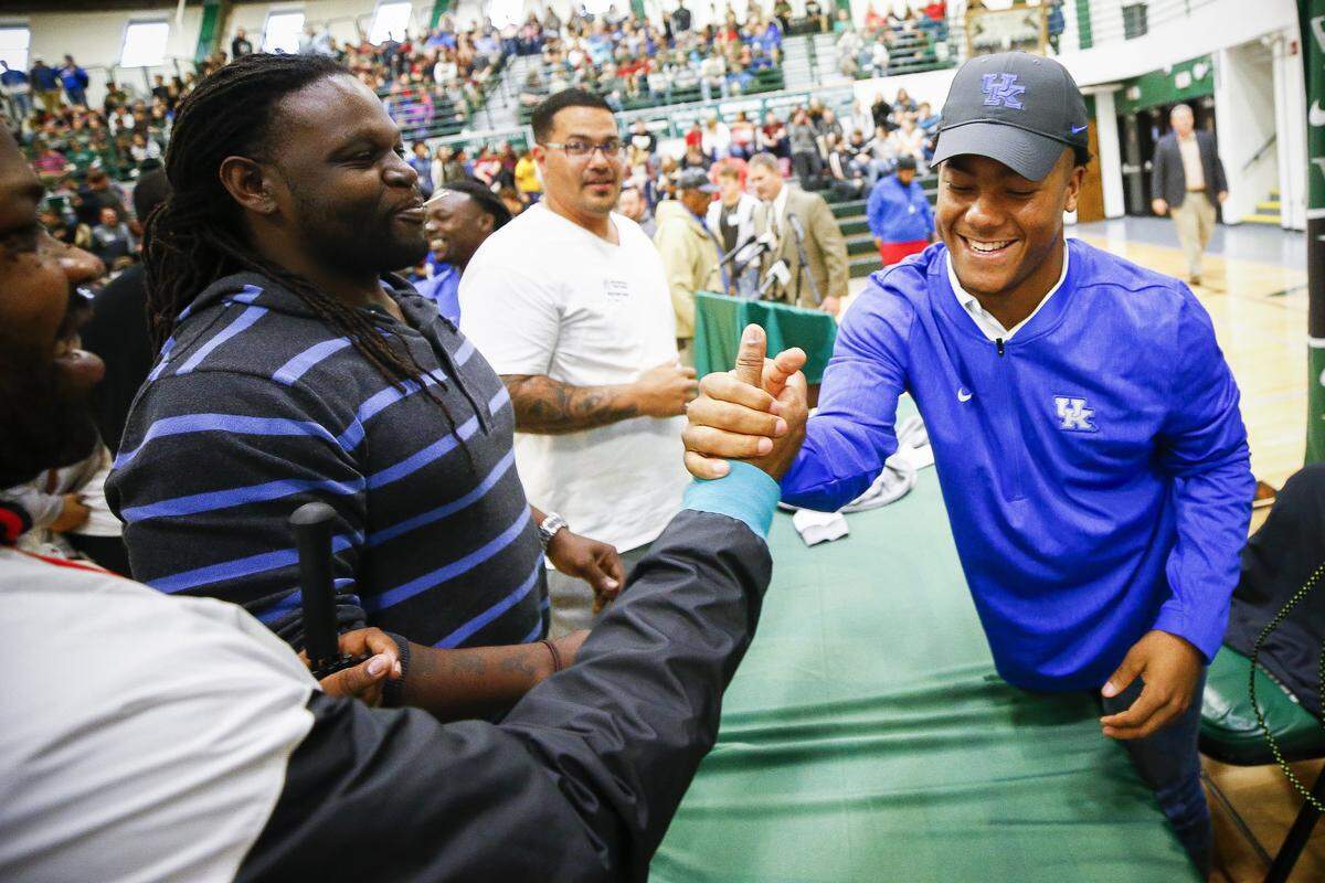 File photo: Western Hills four-star running back Wandale Robinson celebrated with friends, family members and classmates after committing to the University of Kentucky on Nov. 1, 2018. He later flipped his commitment to Nebraska.
