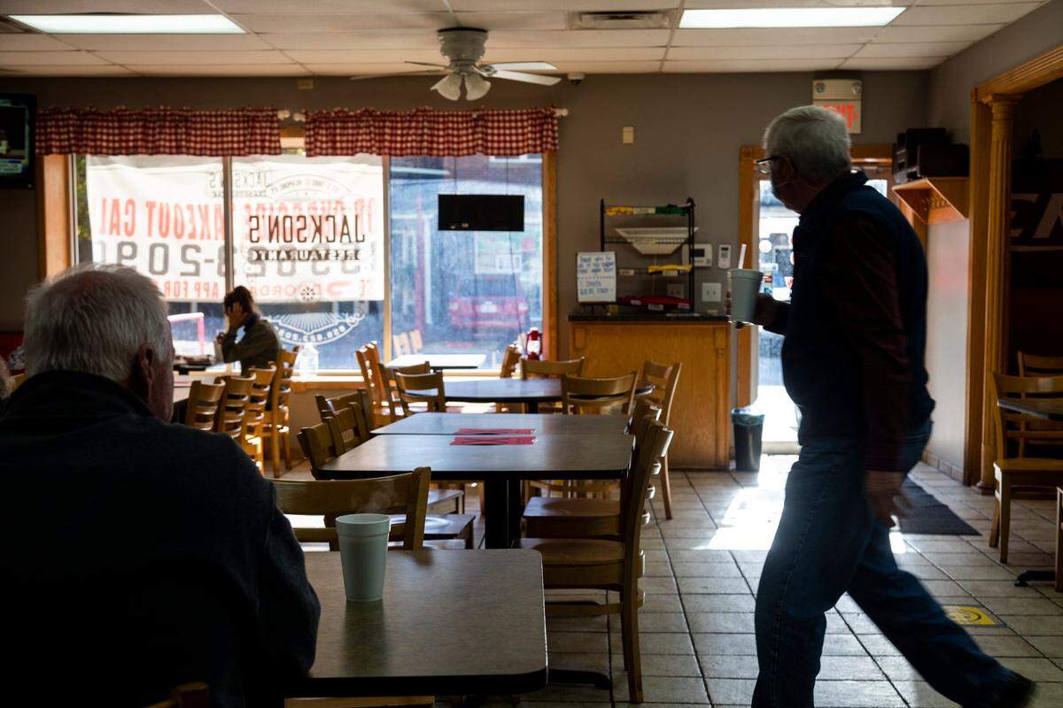 Regulars settle down for their meals and morning routines Oct. 14 at Jackson’s Restaurant in Richmond.