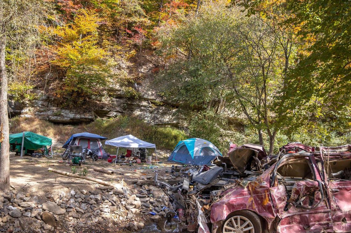 Flood debris is visible along Lower Caney Creek Road where a person was living in a tent on Tuesday, Oct. 11, 2022, in Breathitt County, Ky.