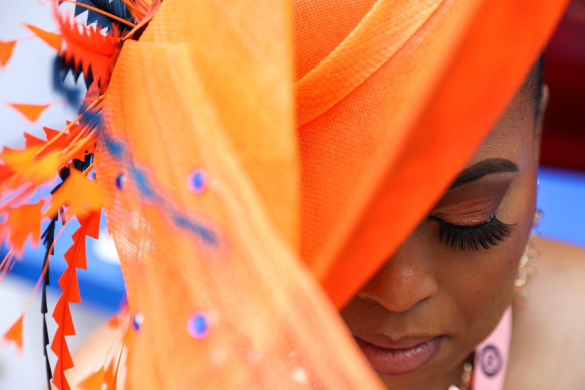 Thyra Treco with a bright orange and blue hat at Churchill Downs in Louisville, Ky., Saturday, May 4, 2024.