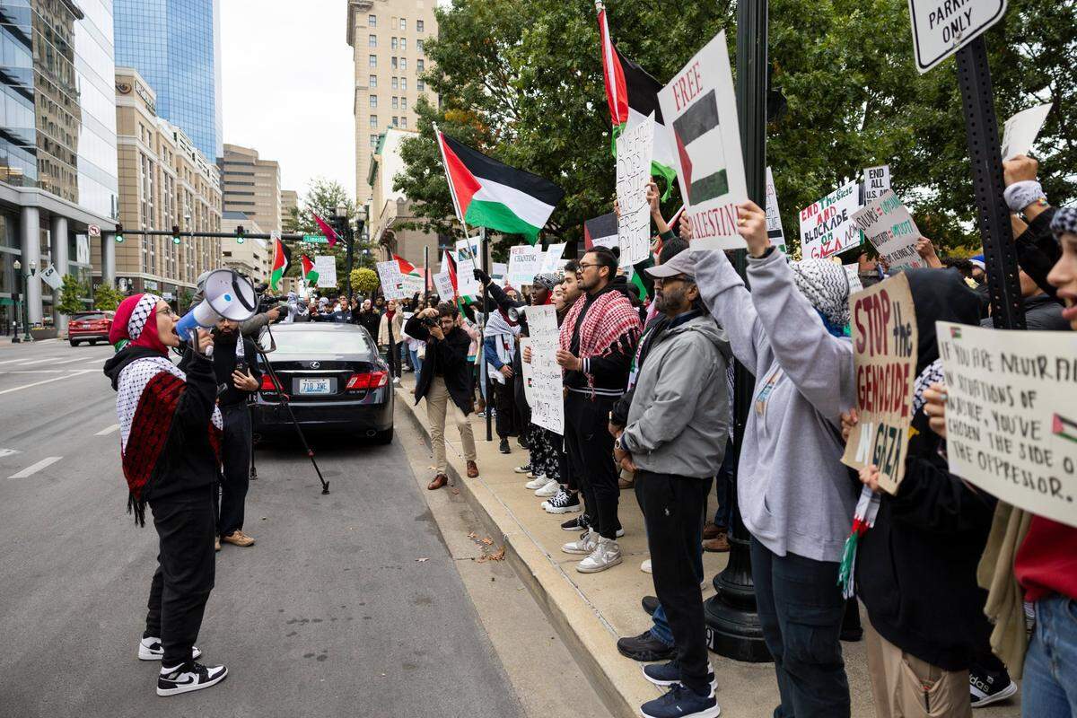 People chanted at the End the Genocide in Gaza rally Tuesday night at the courthouse plaza in Lexington.