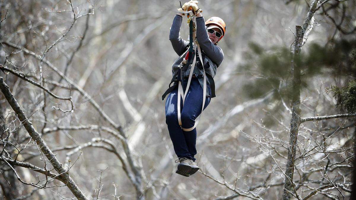 In this 2013 file photo, Mackenzie Leachman used a zip line at Boone Creek Outdoors in Lexington Photo by  Mark Cornelison | Staff