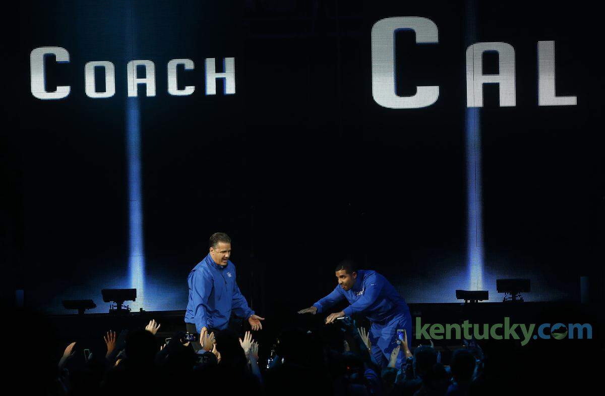 Recording artist Drake, right, bows to Kentucky Wildcats head coach John Calipari during Big Blue Madness Rupp Arena Friday, Oct. 17, 2014.