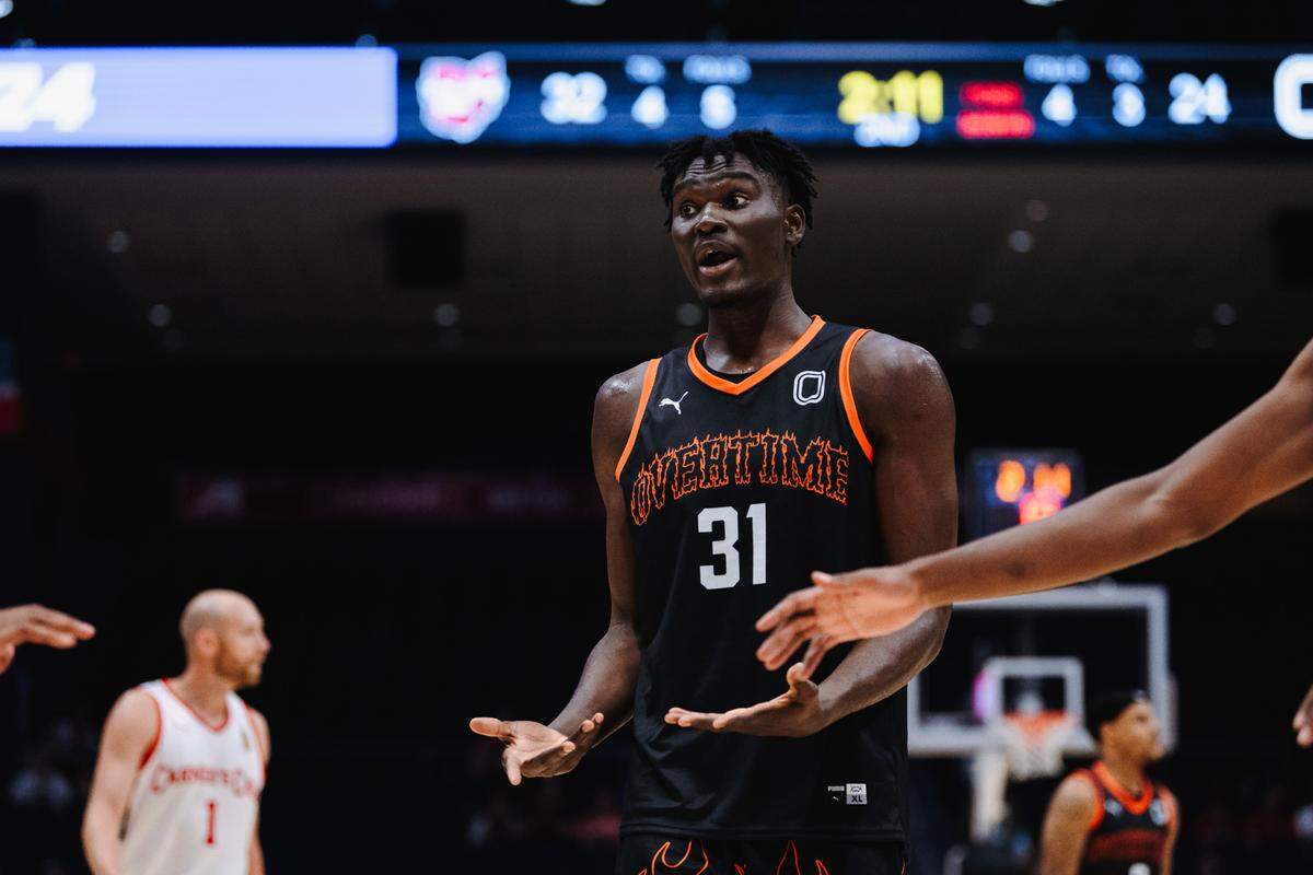 Class of 2024 Kentucky men’s basketball commit Somto Cyril gestures to his teammates while playing for Team Overtime in the The Basketball Tournament in Dayton, Ohio. Cyril was born in Nigeria and moved to the United States in 2021.