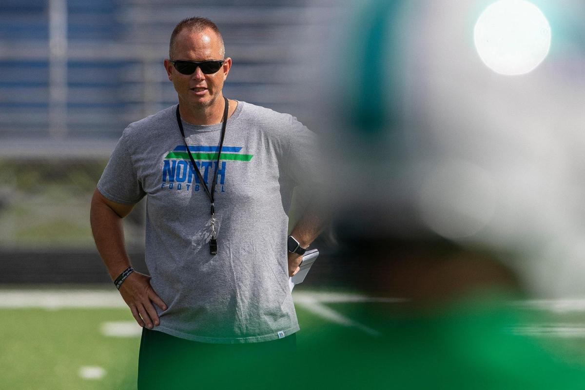North Laurel High School head coach Jason Chappell talks to his team during practice in London, Ky., on Wednesday, Sept. 7, 2022.